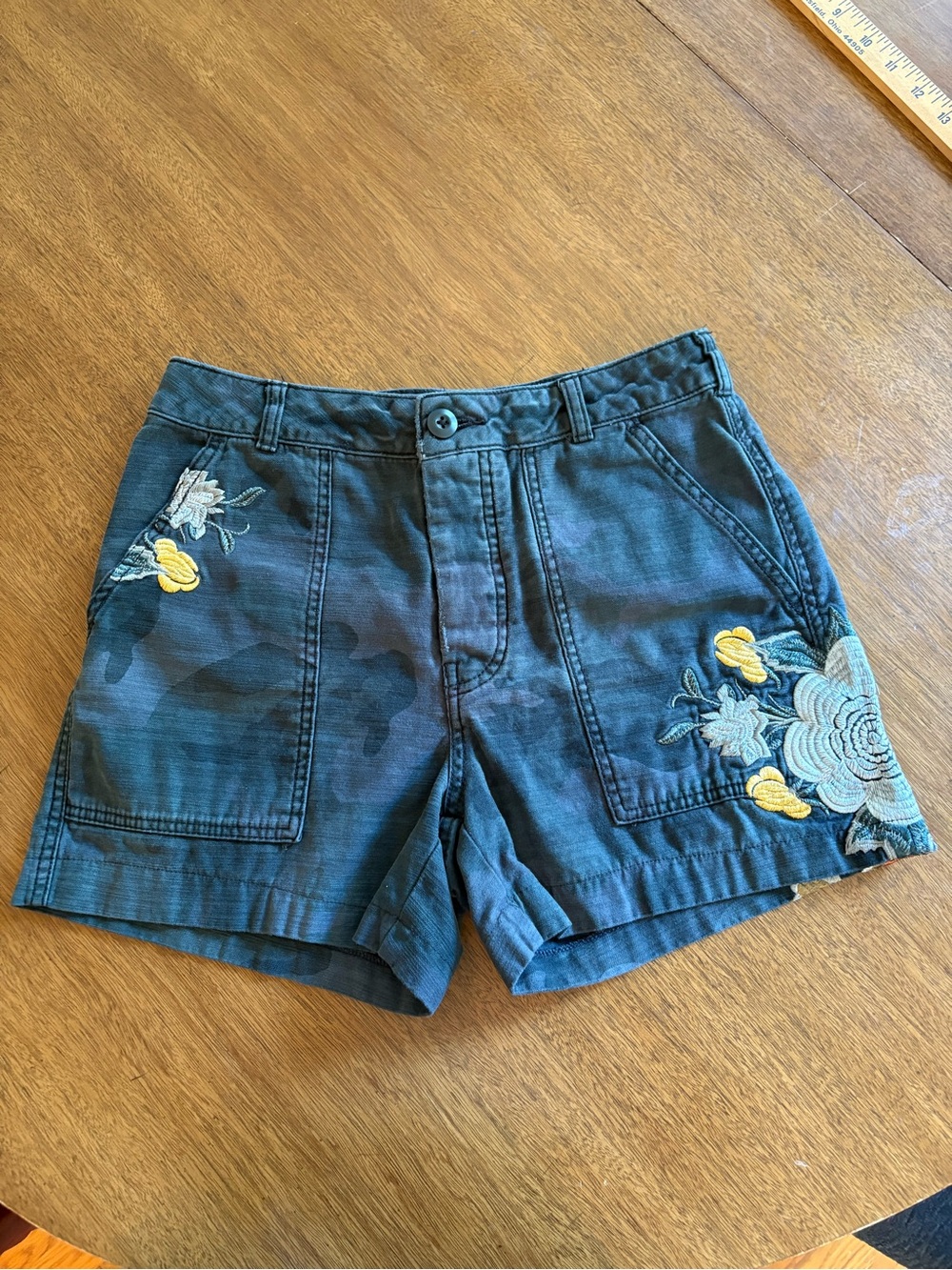 Free People Scout shorts feature a dark camouflage pattern